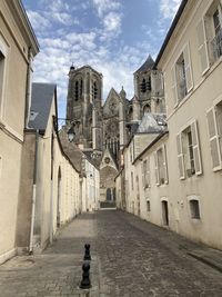 Footpath amidst buildings in town