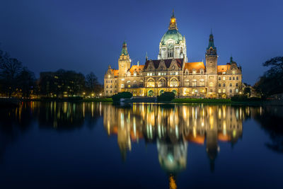 Reflection of buildings in water at night