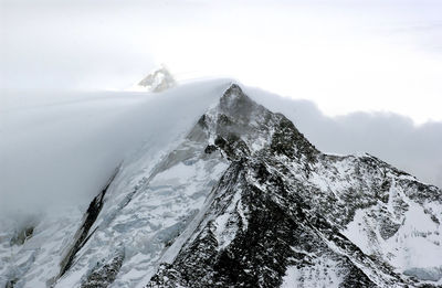 Scenic view of mountains against sky during winter