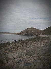 Scenic view of sea against cloudy sky