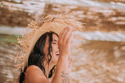 Portrait of woman against blurred background