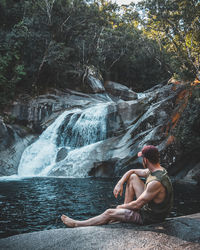 Man sitting on rock