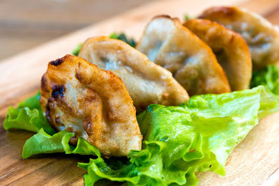 Close-up of fresh dumplings served on table