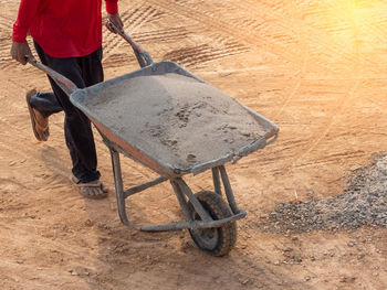 Low section of man working on road