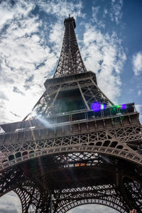 Low angle view of tower against cloudy sky