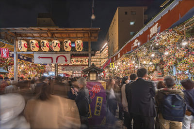 People walking on street at night