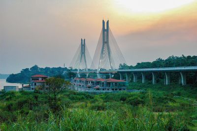 View of bridge against cloudy sky