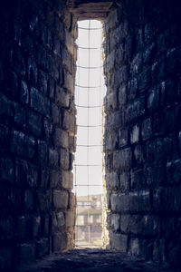 Low angle view of brick wall in building