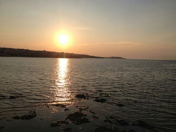 Scenic view of sunset over river