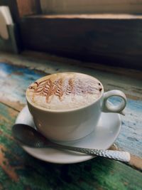 Close-up of cappuccino on table