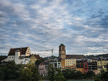 Low angle view of buildings in town against sky