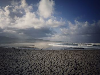 Scenic view of beach against sky