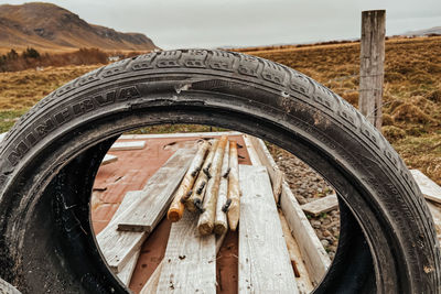 Close-up the tire track on field against icelandic sky