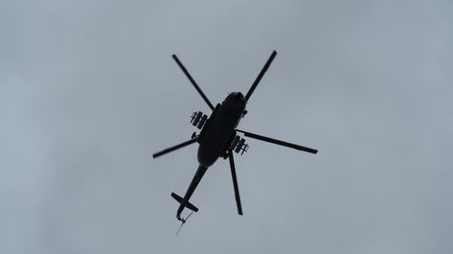 Low angle view of airplane flying against sky