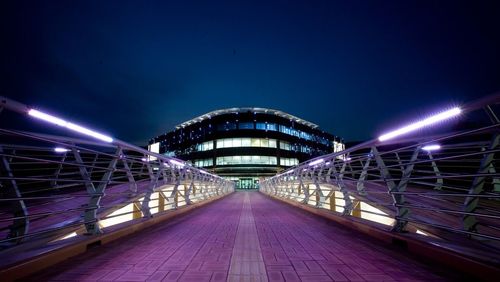 Illuminated bridge at night