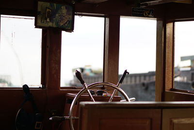 Close-up of motorcycle against window