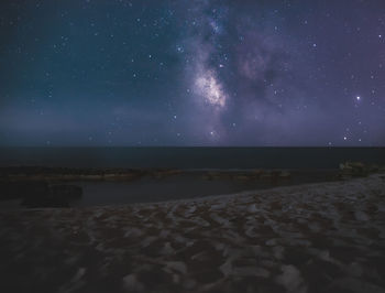 Scenic view of sea against sky at night