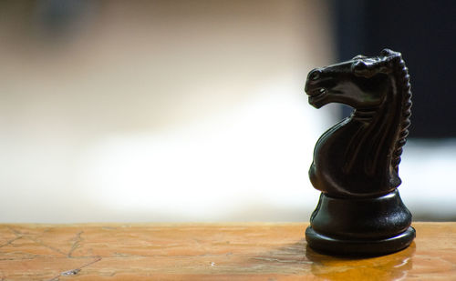 Close-up of statue on table against the sky