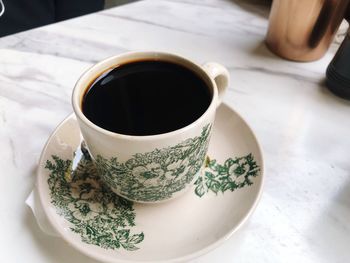 High angle view of coffee cup on table