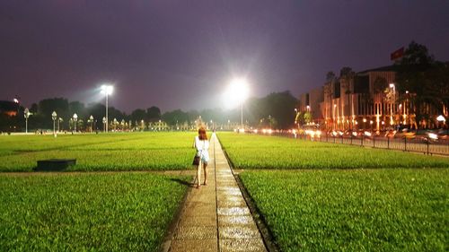 People on grass at night