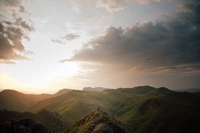 Scenic view of mountains against sky during sunset