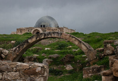 Old ruin building against cloudy sky