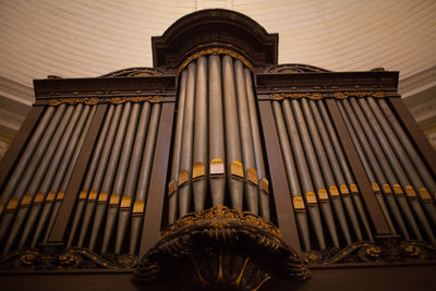Low angle view of pipe organ in church