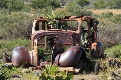 Abandoned vehicle on field
