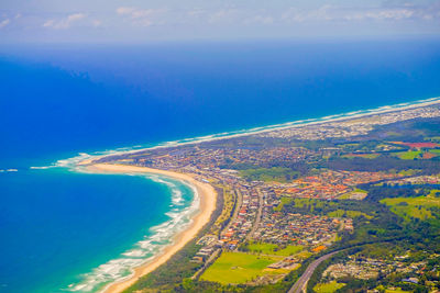 High angle view of sea shore against sky