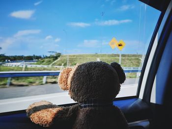 Rear view of toy car against window