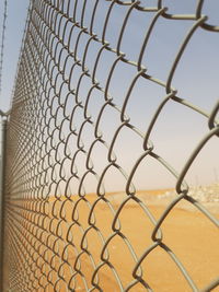 Close-up of chainlink fence against clear sky