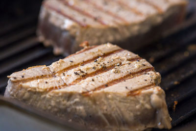 High angle view of meat on barbecue grill