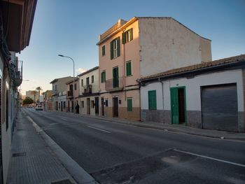 Street amidst buildings against sky