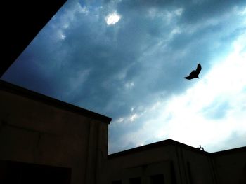 Low angle view of building against cloudy sky