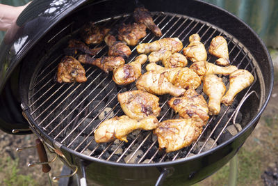 High angle view of meat on barbecue grill