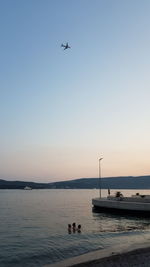 Scenic view of sea against clear sky during sunset