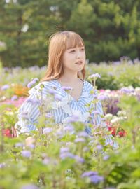 Portrait of a beautiful young woman outdoors