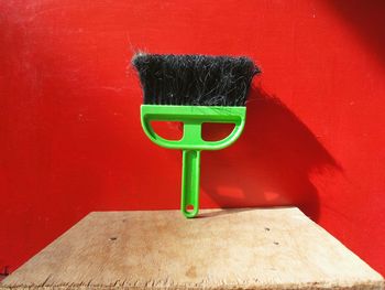 Close-up of brush on wooden table