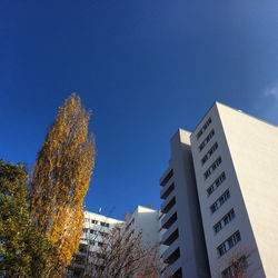 Low angle view of building against clear blue sky