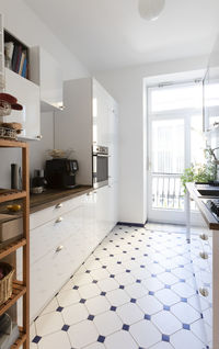 Modern kitchen with patterned flooring at home