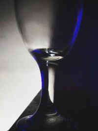 Close-up of beer glass against black background