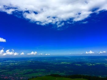 High angle view of landscape against blue sky