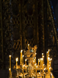 Lit candles on altar