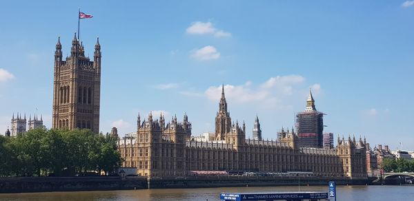 Houses of parliament and river thames viewed from the south bank in london, england.