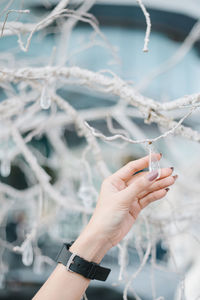 Cropped hand of woman holding decoration