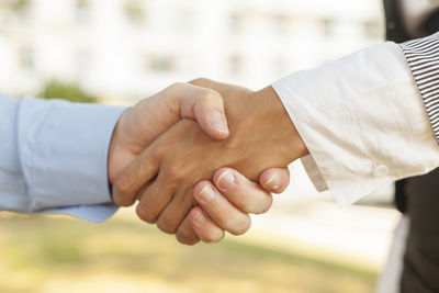 Close-up of man holding hands