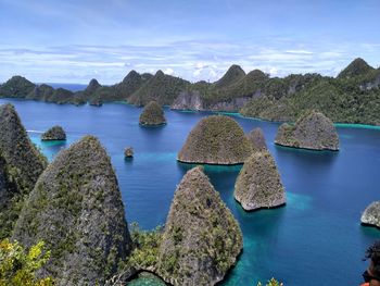 Panoramic view of sea and rocks against sky