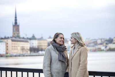 Mother with adult daughter in urban setting