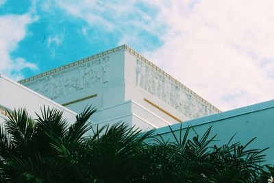 Low angle view of building against cloudy sky