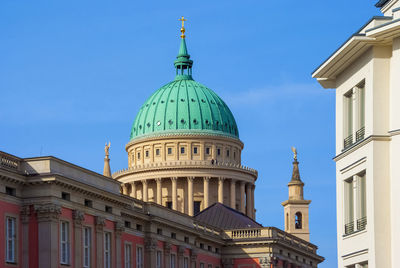 Low angle view of building against sky in city